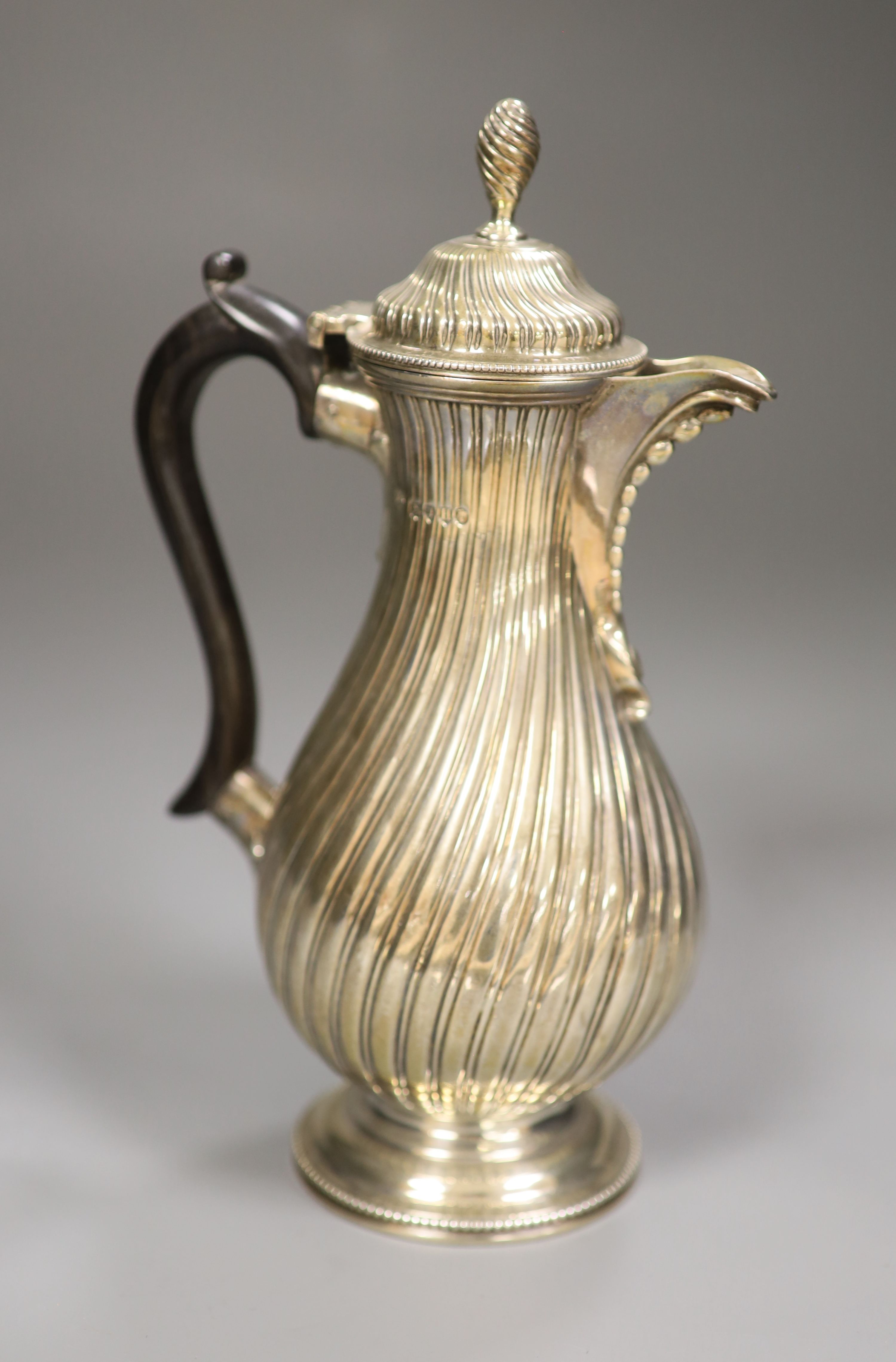 A Victorian fluted silver hot water pot, Charles Stuart Harris, London, 1883, 22.6cm, gross 11.5oz.